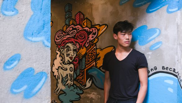Sean Shih with Used Pencil's mural