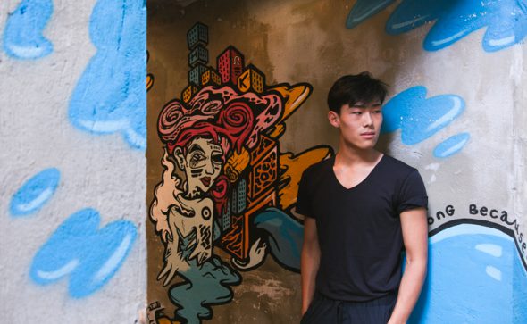 Sean Shih with Used Pencil's mural