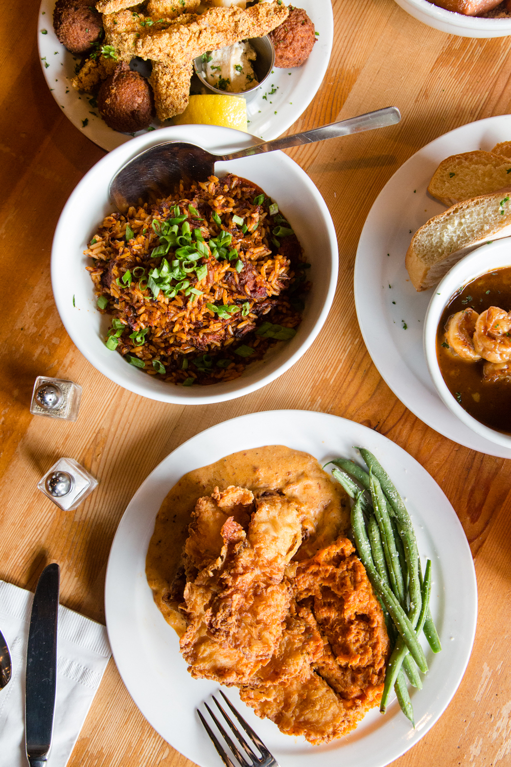 Dinner spread at Angeline's Louisiana Kitchen – Jambalaya, Hush Puppies, Fried Chicken ...