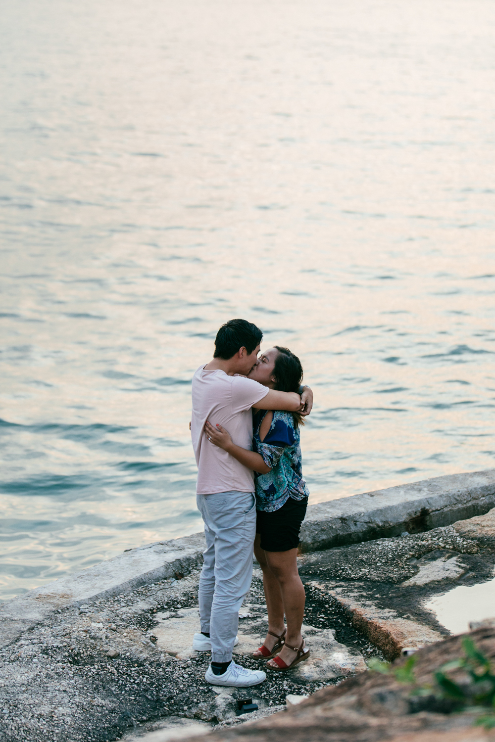 A hug and a kiss | Candid engagement photography | Tracy Wong
