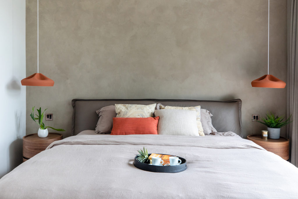 Bedroom styling with rusty orange accessories